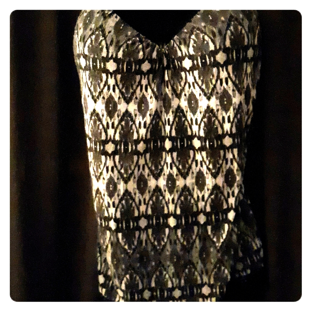 Shirt with spaghetti straps and lace.